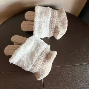 Detail showing plush faux shearling texture and warm knit material on fingerless gloves