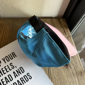 Detail of breathable blue mesh baseball cap with adjustable strap and pink brim