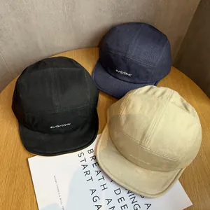 Cute cartoon emoji camper hats in black, navy, and beige with stylish letter embroidery