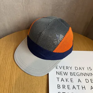 Detail of multi-color mesh running cap showing breathable fabric and reinforced stitching