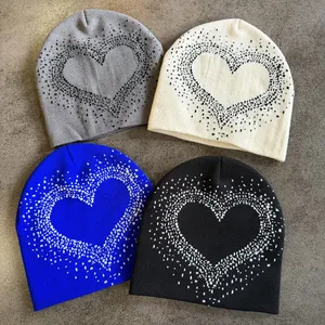 Winter knit beanies with heart pattern in grey, beige, blue and black colors