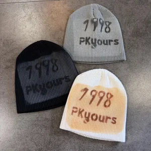 Three hip-hop graffiti knitted beanies in black, grey, and white-yellow for autumn winter