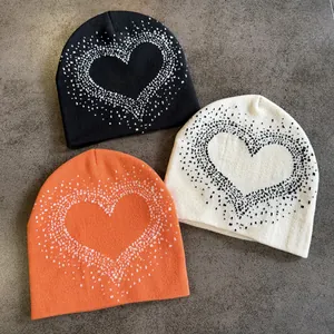 Three-piece knit beanie set in black white and orange with heart pattern for winter