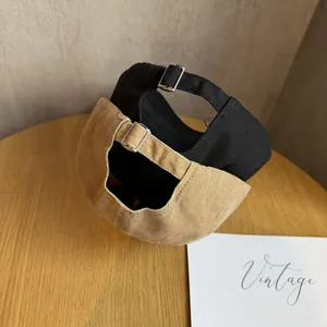 Vintage cotton baseball caps in black and khaki with adjustable metal back buckle