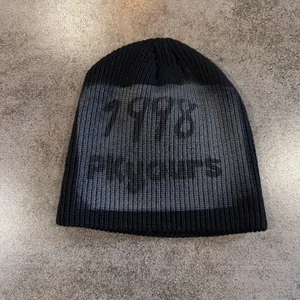 Detail of knitted beanie featuring 1978 number pattern and street style texture
