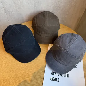 Vintage washed cotton short brim camp caps in black, brown, and charcoal gray colors