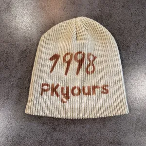 Detailed knit texture of the 1998 PKyours beanie in cream beige hip-hop style