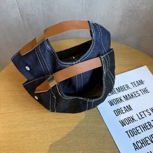Denim baseball caps in navy and black with contrast stitching and leather straps