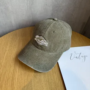 Detail of vintage washed canvas baseball cap featuring premium Boston letter embroidery