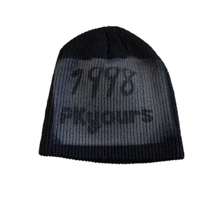 Streetwear black knit beanie featuring gray 1978 graffiti print and ribbed texture
