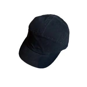 Unisex black washed canvas short brim baseball cap with a vintage minimalist street style design