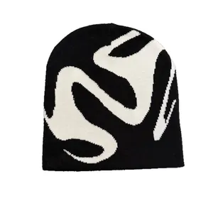 Streetwear knit beanie in black and white jacquard pattern for winter warmth