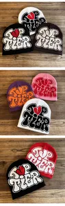 Detailed grid of knitted beanies featuring Top Tier text and heart patterns in six colors