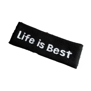 Bandeau de sport en tricot noir avec broderie Life is Best sur fond blanc pur