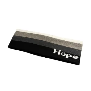 Fascia sportiva in maglia con sfumature di grigio e dettaglio con scritta Hope