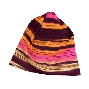 Colorful striped knitted slouchy beanie hat for women featuring a soft multi-color pattern