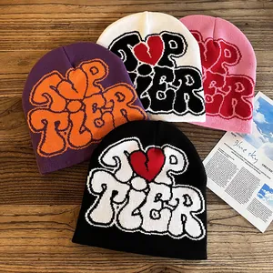 Cozy knit beanies with TOP TIER heart jacquard pattern in purple, white, pink and black