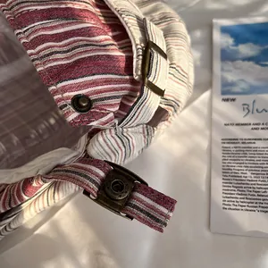 Close-up of vintage striped newsboy cap with adjustable metal buckle and retro fabric