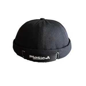 Classic black canvas docker cap with MasicM embroidered strap and metal buckle