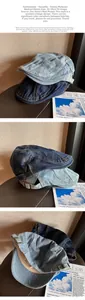 Detail of vintage washed denim newsboy cap showing metal buckle and retro texture