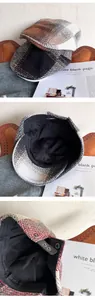 Detail of vintage herringbone tweed beret showing inner lining and adjustable leather strap