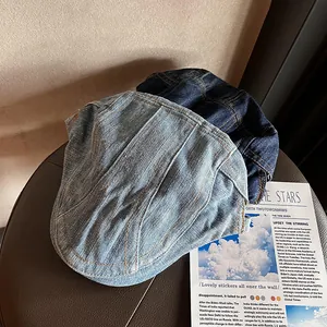 Vintage denim flat caps in light and dark blue with contrast stitching for men and women