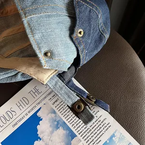 Retro patchwork denim newsboy cap with adjustable metal buckle and vintage aesthetic