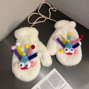 Close-up of white plush mittens with cute monster face and long neck strap for winter