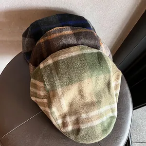 Three retro plaid newsboy caps in green, coffee, and blue wool blend fabric