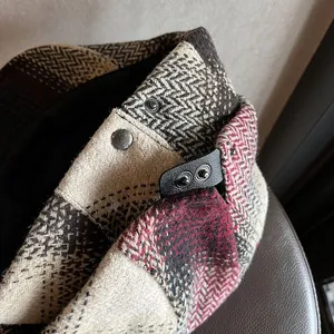 Retro plaid wool newsboy cap with herringbone pattern and leather strap detail