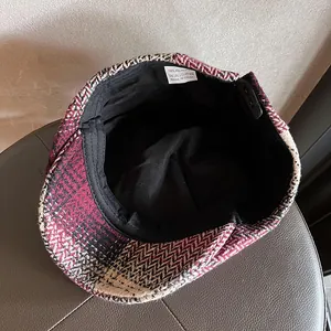 Classic herringbone wool newsboy cap in burgundy and black with soft interior lining