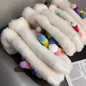 Cute fluffy white plush gloves with colorful pom-poms for winter warmth and comfort