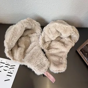 Thick beige faux fur trapper hat with pink adjustable strap for winter warmth