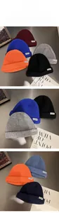 Detailed knit texture and NTRX logo patch on assorted solid color winter docker hats