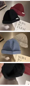 Detailed close-up of textured knit beanies with NTRX labels in assorted classic colors
