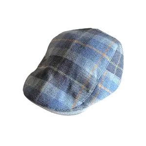 Classic blue plaid ivy cap for men and women featuring a wool-blend check pattern