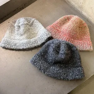 Three gradient knit bucket hats in grey and orange pink tones for winter fashion style