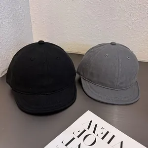 Minimalist cotton short brim baseball caps in black and dark grey for casual street style