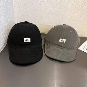 Short brim cotton baseball caps in black and gray with O.Y.X patch logo