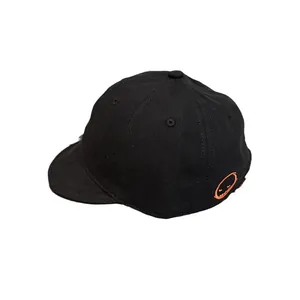 Black short brim baseball cap with orange embroidered smile face and soft top