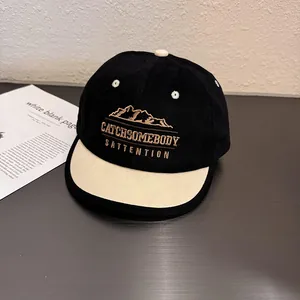 Close-up of the mountain embroidery and typography on this two-tone baseball cap