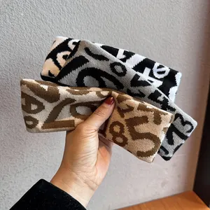 Set of three vintage knitted wide sports headbands with jacquard number patterns