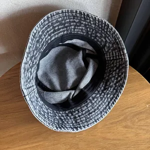 Close-up of vintage washed denim bucket hat showing inner sweatband and stitching details