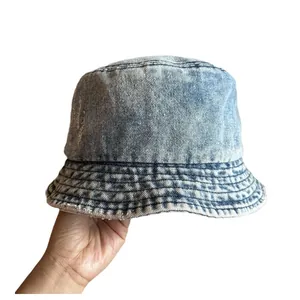 Light blue acid wash denim bucket hat with distressed vintage finish on white background