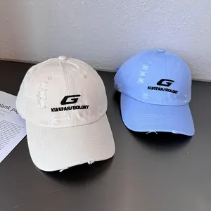 Detailed close-up of distressed cotton baseball caps with G letter embroidery
