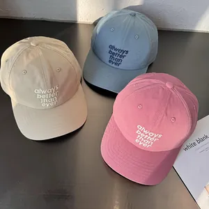 Embroidered cotton baseball caps in beige, blue, and pink colors for men and women