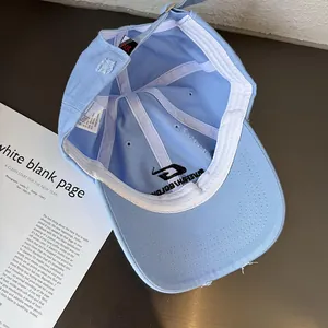 Detail view of cotton baseball cap interior with vintage distressed edge and adjustable strap