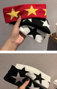 Detailed view of knitted star pattern headbands in various colors with thick texture