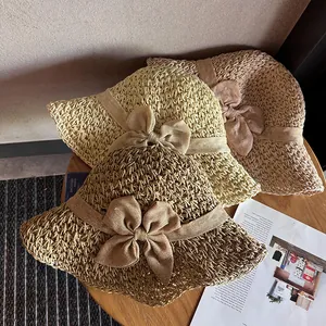 Foldable women's straw hats in three colors with wide ribbons for summer beach sun protection