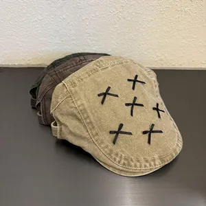 Detailed texture of newsboy caps with ribbon bows in khaki, coffee, and black canvas